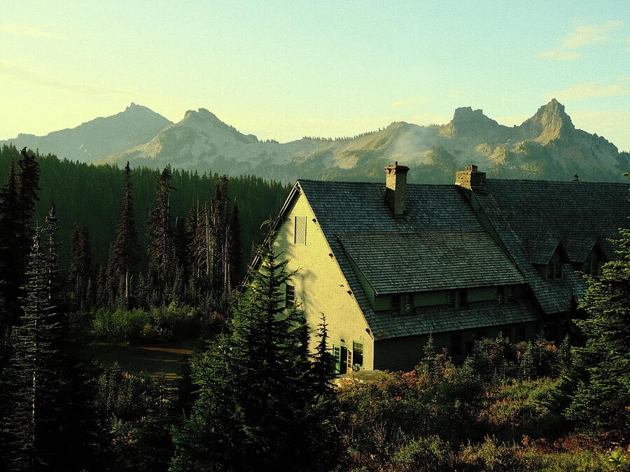 A mountain lodge catches the first light of the day.